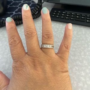 Sterling silver size 5 ring with Chanel set white sapphire stones. 🎊